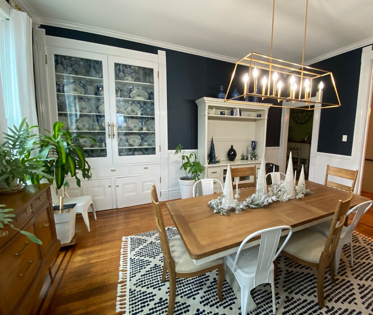 Shared dining room with historic trim and warm light
